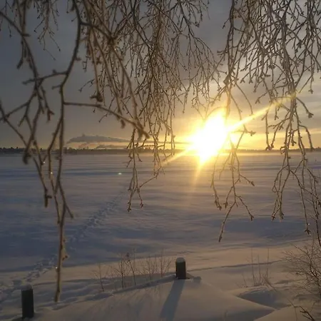 Backyard With Veranda By River In Keminmaa